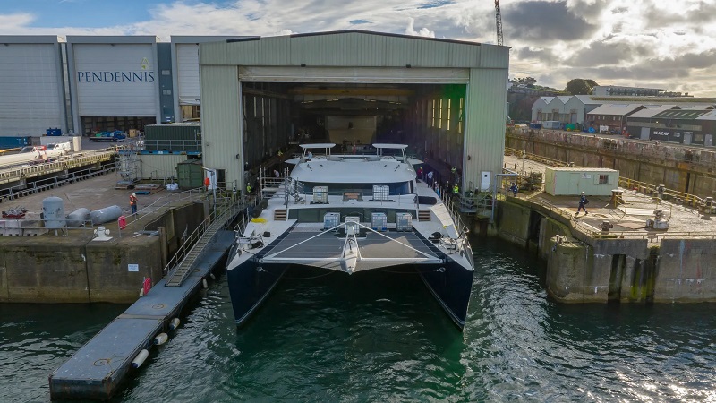 World's largest sailing catamaran returns to Pendennis for refit work