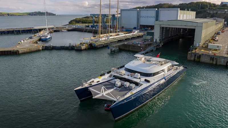 World's largest sailing catamaran returns to Pendennis for refit work
